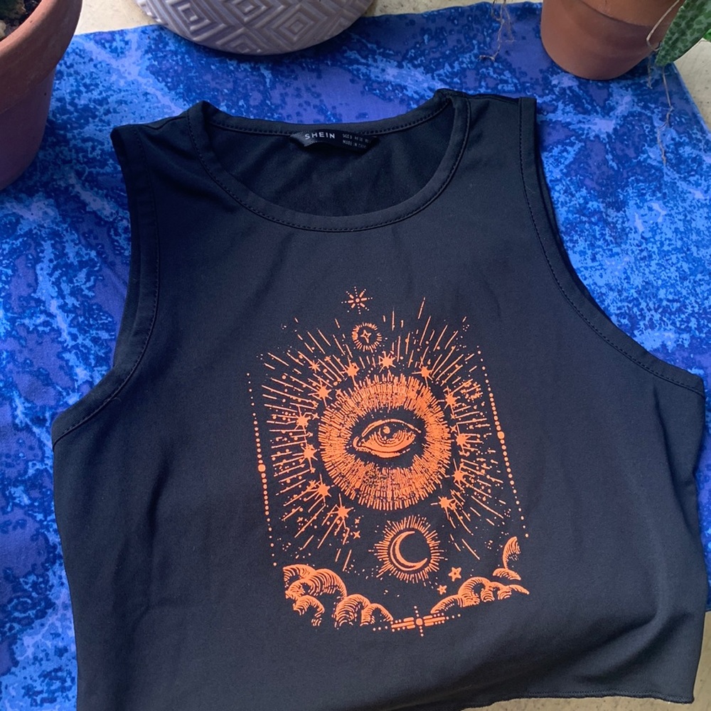 Black, silky, comfortable tank top. Orange design with a spiritual eye.